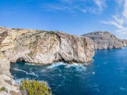 A view of cliffs under a blue sky