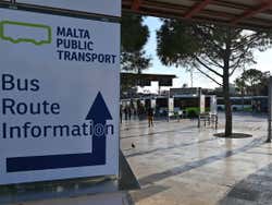A white sign for the bus station