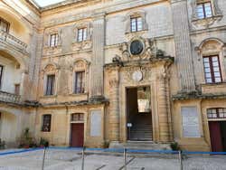 A beige-coloured stone elegant building