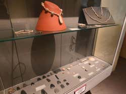 Some ancient pieces of jewellery in a glass display case