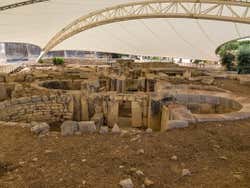 Ancient megalithic ruins covered by a white tent