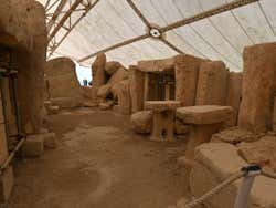 The remains of the Hagar Qim temple covered overhead by a protective tent